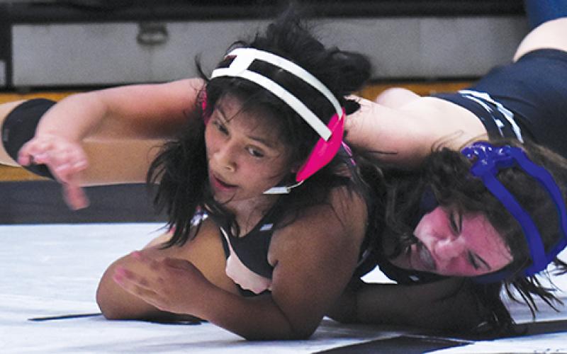 Alexis Miller slams teammate Julia Vazquez during Nov. 7’s scrimmage. Photo by Bella Eddings/The Graham Star
