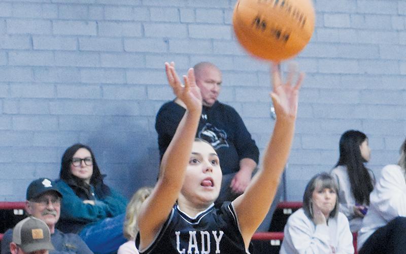 McKynlee Adams launches a long-range jumper Dec. 19 at Andrews. Photo by Kevin Hensley/sports@grahamstar.com