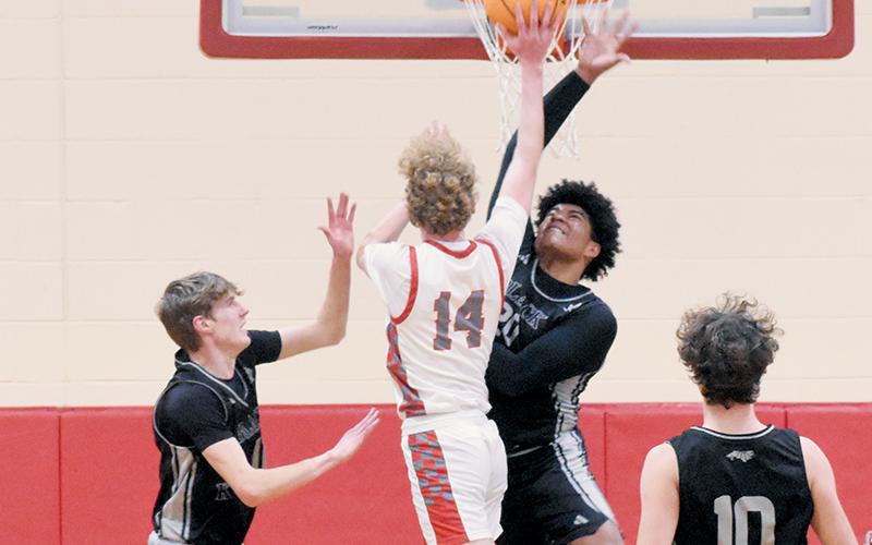 Robbinsville’s Kyzik Teesateskie (20) defies gravity to deny Copper Basin’s Talon Smith on Monday. Photos by Kevin Hensley/sports@grahamstar.com