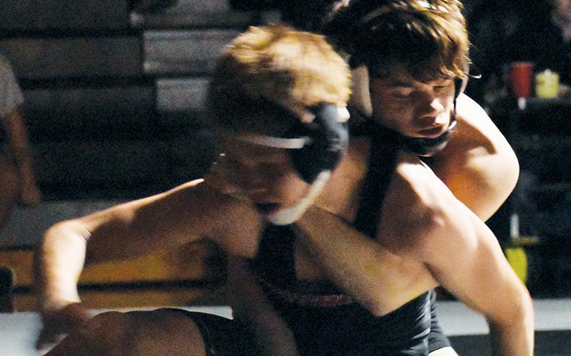 Skyler Anderson wraps up West-Oak’s Gunner Mease during the 106-pound finals of the James Orr Invitational on Saturday. Photos by Bella Eddings/The Graham Star
