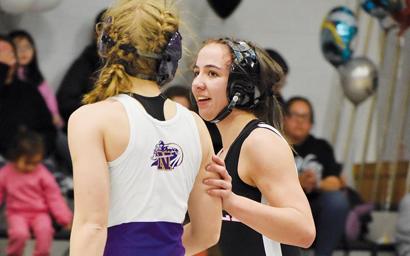 Showing tremendous class, Alexis El-Khouri congratulates North Henderson’s Sophie Stepp on a hard-fought bout after El-Khouri bested Stepp 4-3 on Jan. 22.