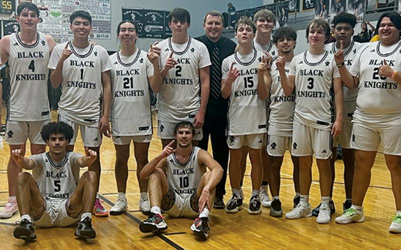 The Smoky Mountain Conference title returned to the Black Knights on Tuesday, following a victory over Cherokee. Standing in back (from left) are Nathan Frederick, Roman Jones, Kenyon Swimmer, Quinn Jumper, Isiac Collins, head coach Jake Beasley, Dane Knott, Kasen Buchanan, Trey Lambert, Luke Lovin, Kyzik Teesateskie, Logan  Callaway and manager Joshua Satterfield. Sitting in front are Darion Ledbetter (left) and Bryce Adams. Photo by Kevin Hensley/sports@grahamstar.com