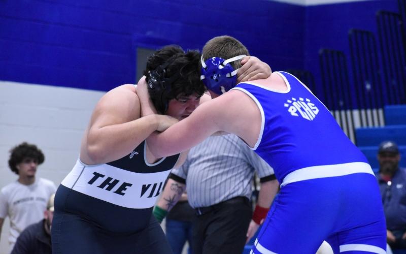 Robbinsville heavyweight Jonah Teesateskie (left) locks horns with Polk County's Brady Carroll during the third round of the 1A state duals Feb. 5. Teesateskie was 1-of-7 Black Knights to qualify for the individual state tournament. Photo by Kensie Belk/The Graham Star