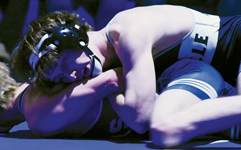 Loxston Hooper ties up Mount Airy’s Jeremiah Brooks in the 1A Western Regional title match Feb. 5.