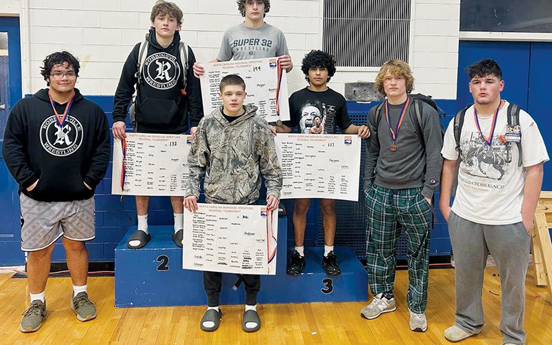 Robbinsville wrestling’s seven state qualifiers stand proudly at the conclusion of the 1A Western Regional tournament Saturday. From left are Jonah Teesateskie, Loxston Hooper, Skyler Anderson, Lleyton Hooper, Adair Panama, Devin Hall and Kellen Ensley. Photo courtesy of Brooke Haney/Robbinsville Wrestling