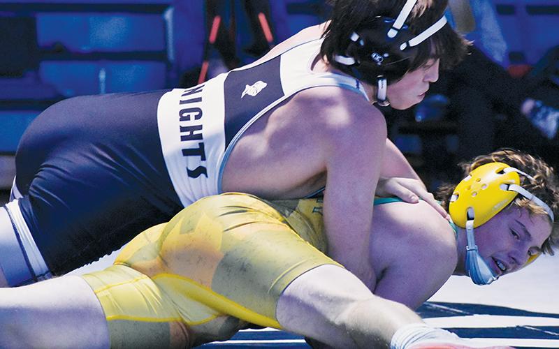 Knox Orr controls Alleghany’s Elijah Barker during the second round of the state dual-team postseason Saturday. Orr went on to pin Barker and clinch a third-round berth for Robbinsville. Photos by Bella Eddings/The Graham Star
