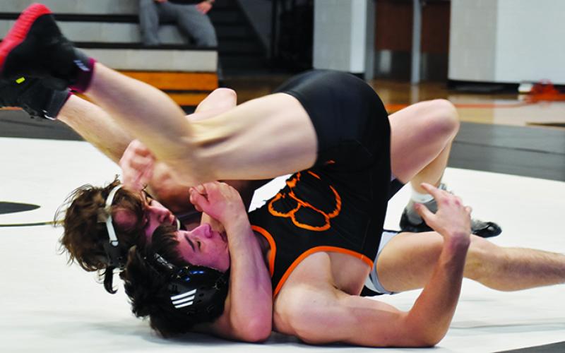 Lleyton Hooper cinches a near-fall on Rosman’s Koen Kiser during Saturday’s first-round postseason dual. Hooper won the bout via technical fall.