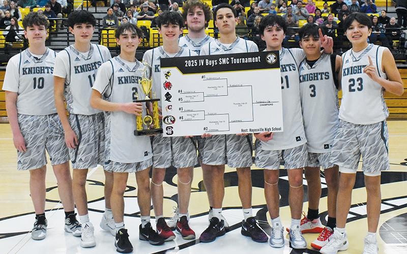From left are the 2024-25 Smoky Mountain Conference JV Boys Smoky Mountain Conference Tournament champions, the Robbinsville Black Knights: Elliott Beasley, Slade Freeman, Eli Lambert, Bam Nelms, Landon Eddings, Tucker Jones, Elijah Kirkland, Xamuel Wachacha and Khayton Swimmer.