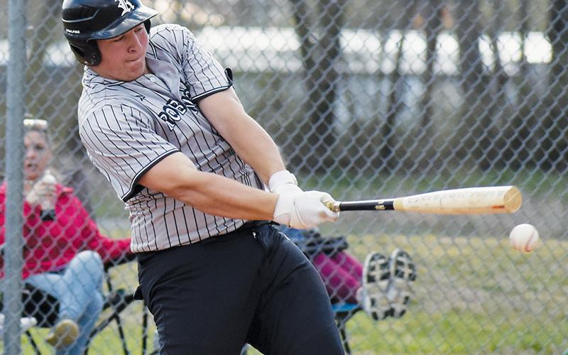 Dayne Webster drives the ball March 25 against Hiwassee Dam. Photo by Bella Eddings/The Graham Star