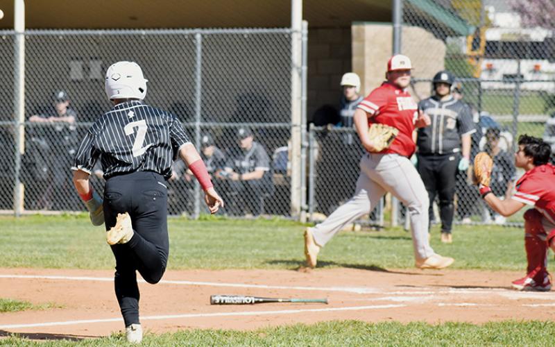 Robbinsville’s Easton Shuler (2) tries to beat the relay throw to home plate during Game 1 of April 9’s doubleheader against Franklin. Photo by Bella Eddings/The Graham Star