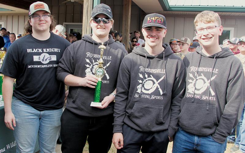 Members of the Robbinsville Shooting Team accept the program’s second-place trophy in hunter skills at March 16’s district tournament. From left are Murphy Shanahan, Ryan Lynn, Avery Brown and Wade Franado. Not pictured are Myley Hyde and Mason Satterfield. Photo courtesy of Cheri Lynn/Robbinsville Shooting Team