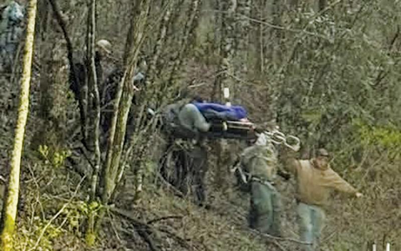 Rescuers descend off the Appalachian Trail with an injured hiker at Yellow Creek Gap on Friday.