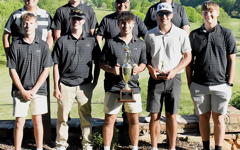 With the setting sun beaming down, the Robbinsville Black Knights soak in the reality of their first Smoky Mountain Conference golf championship in 25 years. The team clinched the title Monday at Mountain Harbour Golf Course in Hayesville, at the conclusion of the two-day league tournament. Photo by Kevin Hensley/sports@grahamstar.com