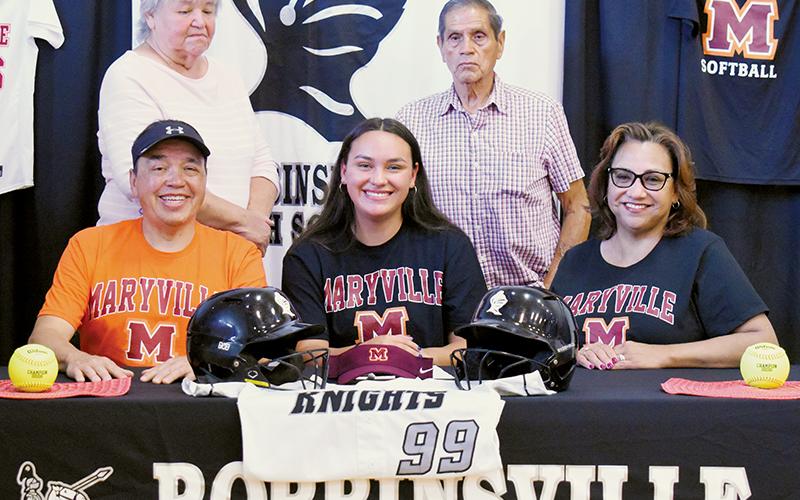 Robbinsville senior Naomi Taylor signed to play with Maryville College on Monday. Seated with Naomi are father Bo (left) and mother Esther. Standing in back are grandparents Joyce and Bob Taylor. Photo by Kevin Hensley/sports@grahamstar.com