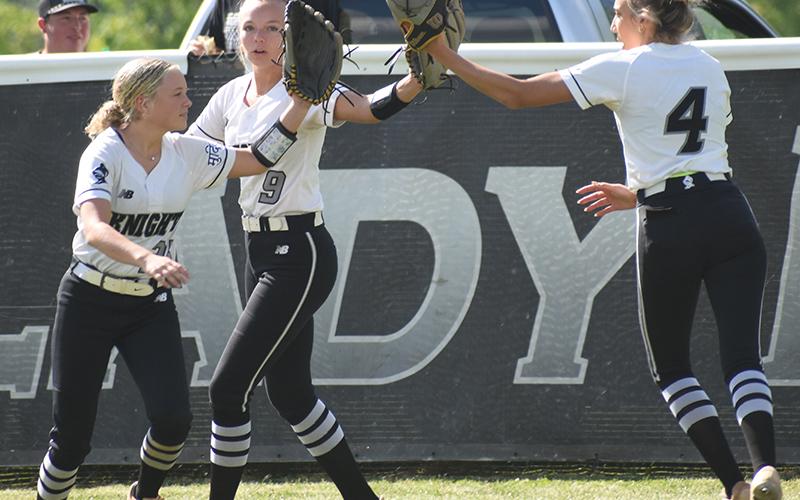 Lexie Williams, Sydney Adams and Anna Williams (from left) complete their outfield warm-ups in a unique manner prior to Tuesday's first-round playoff game against Mitchell. Photo by Lexie Anderson/The Graham Star