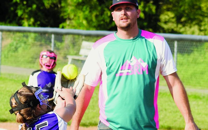 Wyleigh Gibby reaches for a pop-up during Monday's 8U coach-pitch game between Murphy/Ranger All-Stars and Robbinsville. Photo by Kevin Hensley/sports@grahamstar.com