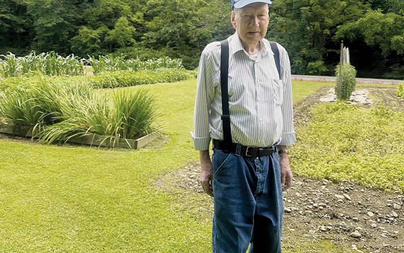Even at the age of 87, James Crisp works with his wife Sara to raise a garden each year that catches the eye of anyone who turns onto Mill Creek Circle. Photo by Latresa Phillips/The Graham Star