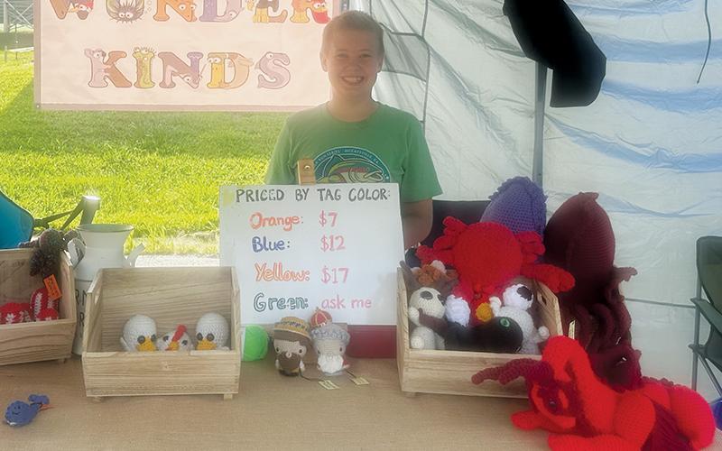 The Graham County Farmers Market has successfully launched a youth entrepreneurship program, which has given local teenagers the opportunity to learn all the steps involved in running a business. Visitors to the weekly market can find booths such as Joshy Kamps' "Wunder Kinds." Photos by Latresa Phillips/The Graham Star