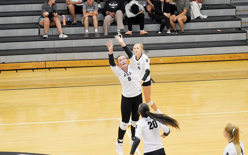 Looking on as senior Ryn Hooper (8) sets the ball during Tuesday’s home opener against Blue Ridge School are Khaygen Buchanan (4), Emory  Chekelelee (20) and Novie Dutcher (4). Photo by Lexie Anderson/The Graham Star