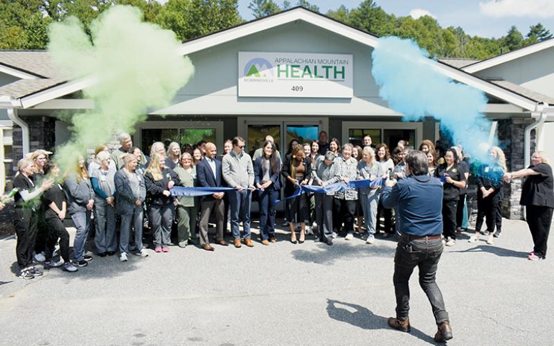 Staff and management of Appalachian Mountain Health celebrate a ribbon cutting held Monday outside the  Robbinsville office on Tallulah Road. The ceremony recognized a recent batch of upgrades to the facility. Photos by Kevin Hensley/editor@grahamstar.com