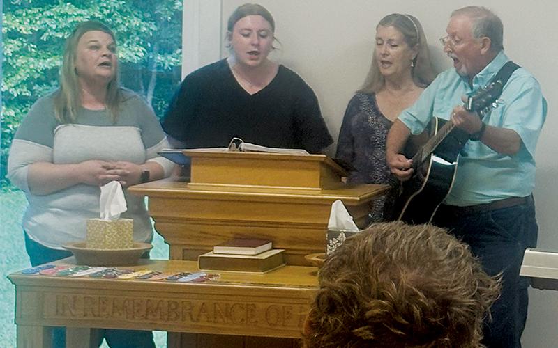 Jennifer O'Dell, Gracie Webster, Regina Webster and Dickey Webster (from left) with Sweetgum Baptist Church sing at a recent Celebrate Recovery meeting. Photos by Latresa Phillips/The Graham Star