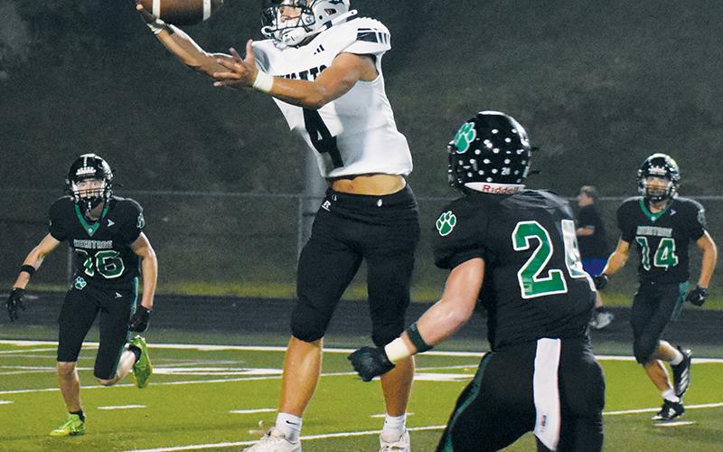 Cameron Allison reels in a one-handed reception for a big gain during Friday’s game at Mountain Heritage. Allison finished the night with 139 receiving yards. Photo by Kevin Hensley/sports@grahamstar.com