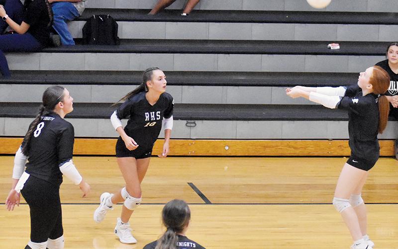 Kynadee Spencer saves the ball from dropping on the outside during Tuesday’s home match against Andrews. Poised to get things back on-track for Robbinsville are Izabel Haney (10), Ryn Hooper (8) and Chloe Adams (12). Photo by Bella Eddings/The Graham Star