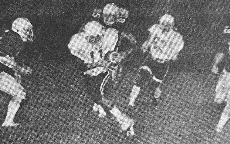 Black Knights quarterback Lamar Shuler charges for a first down during Oct. 2, 1980's game against Hayesville.