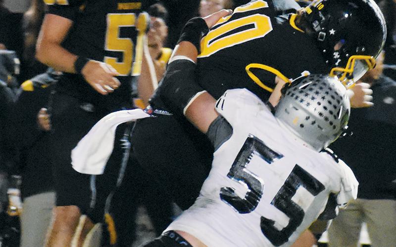 Kasen Buchanan (55) sacks Murphy quarterback Brady Grant to end the first half of action Friday. Photos by Kevin Hensley/sports@grahamstar.com