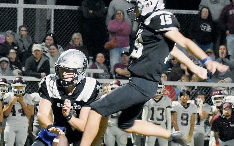 With Luke Lovin serving as placeholder, Robbinsville’s Zander Lucksavage prepares to boot what proved to be the game-winning field goal Friday against Swain County. Lucksavage split the uprights as the final buzzer sounded at Modeal Walsh Memorial Stadium. Photo by Kevin Hensley/sports@grahamstar.com