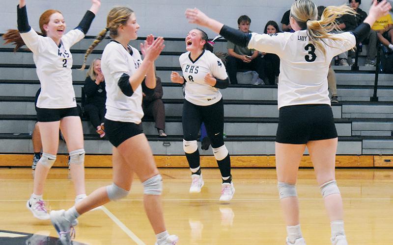 Reality sets in for members of the Robbinsville Lady Knights, moments after completing a sweep of Rosman in the second round of the state playoffs Tuesday. Pictured are Kynadee Spencer (2), Ryn Hooper (8), Zaelyn Phillips and Daphne Barlow (3). Photo by Kevin Hensley/sports@grahamstar.com