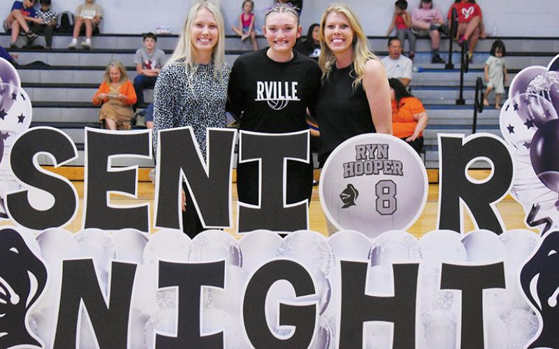 Prior to Tuesday's varsity match against Swain County, Robbinsville High School volleyball recognized its lone senior: Ryn Hooper. With Hooper is assistant coach Kensley Hamilton (left) and head coach Kadey Jones. Photos by Kevin Hensley/sports@grahamstar.com