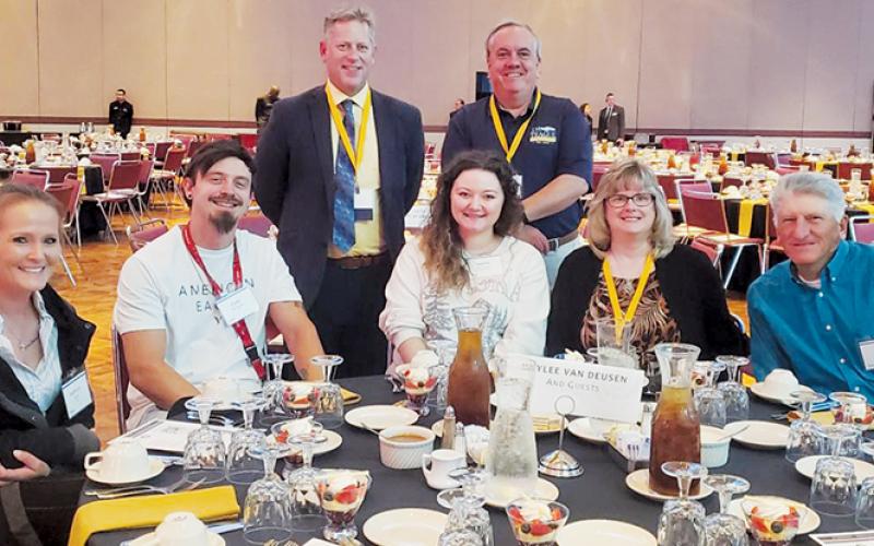 Robbinsville native Haylee Van Deusen (seated, center) is shown surrounded by friends and loved ones prior to receiving the NCWorks Governor's Young Adult Award for Distinction at a ceremony in Greensboro last month.