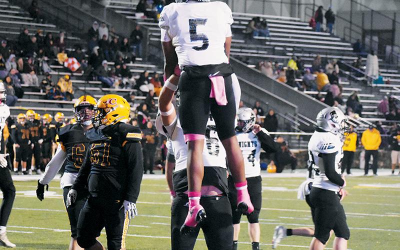 Robbinsville’s Dane Daniels (76) provides some free air time for Kyzik Teesateskie on Friday, after the latter scored his second rushing touchdown at Cherokee. The senior running back leads the Black Knights with 12 touchdowns and enters the postseason with 571 yards on the ground in 2025. Photo by Kevin Hensley/sports@grahamstar.com