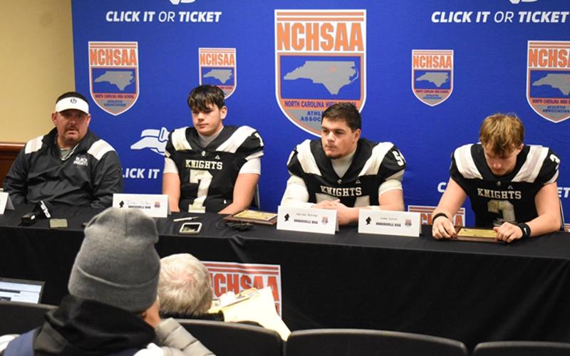 Members of the Robbinsville Black Knights address the media during Thursday's 1A state championship, post-game press conference. From left are head coach Lucas Ford, Isiac Collins, Kellen Ensley and Luke Lovin. Photo by Kevin Hensley/sports@grahamstar.com