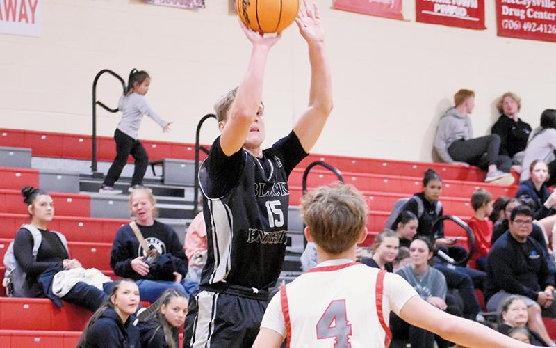 Black Knights senior Dane Knott unleashed six 3's on the Copper Basin (Tenn.) Cougars in Monday's season opener, which played a key role in Robbinsville collecting a victory. Photo by Kevin Hensley/sports@grahamstar.com