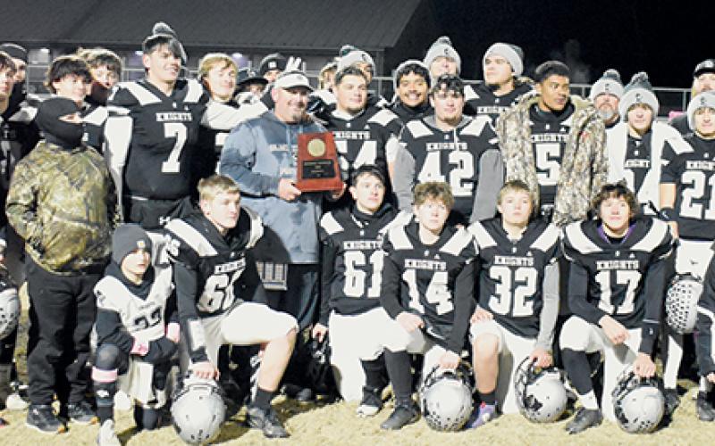 The Robbinsville Black Knights gather in the middle of Bob Colvin Field on Friday, moments after defeating South Davidson to capture the program's 14th 1A Western Regional championship. Photos by Kevin Hensley/sports@grahamstar.com