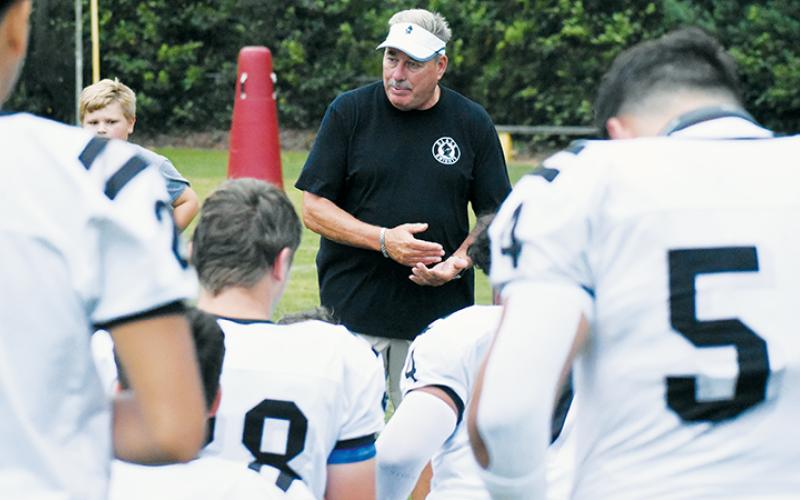 Dee Walsh gives one final pep talk before what proved to be his final preseason scrimmage Aug. 16, 2024 at T.C. Roberson High School. After winning 189 career games in 22 seasons at his alma mater, Walsh announced he was stepping down as both head football coach and Robbinsville High School's athletic director Jan. 24..
