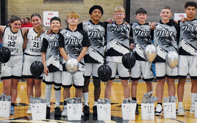 In-between games Dec. 18, Robbinsville Middle School recognized its eighth-grade basketball players. From left are Lady Knights Parklyn Anderson, Calin Gladden, Lakin Orr and Black Knights Kamden Driver, Brayden Allison, David Guzman, Landon Silvers, Carsan Snider, Micah York, Jaxon Blundell and Channing Jones.