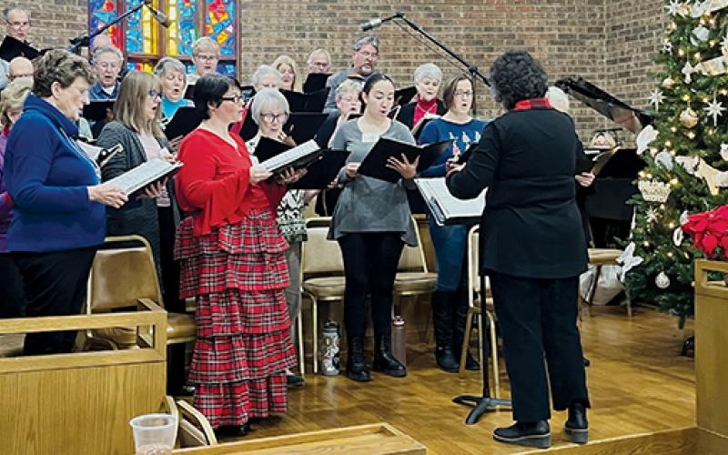 The Robbinsville United Methodist Church and Bryson City First Baptist Church choirs rehearse Sunday, for their upcoming “Music in the Mountains” concert.