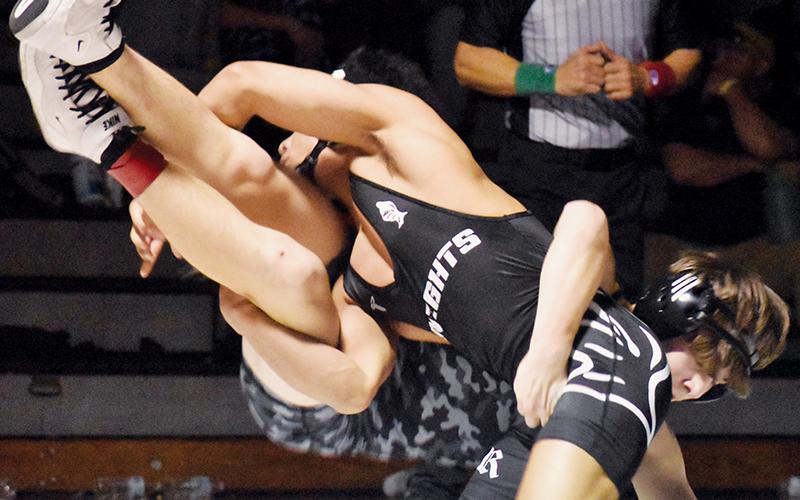 Adair Panama takes down Tuscola's David Levi Wood during the 120-pound finals of Saturday's James Orr Invitational. Photos by Bella Eddings/The Graham Star