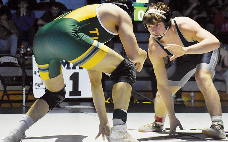 Lleyton Hooper plots his next move against West Forsyth's Abdeen Zaggout in the 157-pound finals of Saturday's James Orr Invitational.