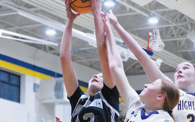 Zaelyn Phillips pulls down one of her team-best 12 rebounds during Jan. 8's overtime, road victory against Highlands. Photo by Kevin Hensley/sports@grahamstar.com