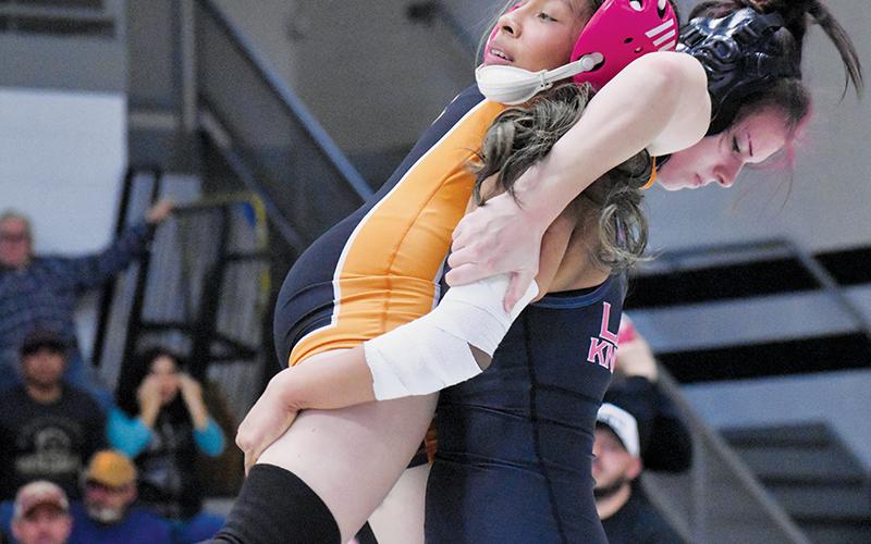 Julia Vazquez has full control of Rosman's Shelby Cloutier in the 107-pound bout of Jan. 8's conference duals. Photo by Bella Eddings/The Graham Star