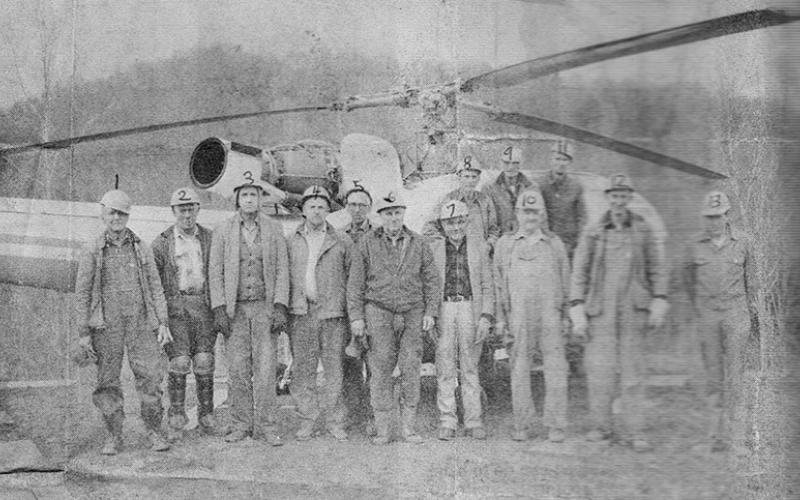 This photo from February 1973 shows the U.S. Forest  Service's "Operation Mainstream" standing in front of a heliport that the crew had built near the Cheoah Ranger Station. Pictured (from left) are Mike Rogers, Clyde  Daniels, Lyle McKeldry, Jake Buchanan, Willie Phillips, Vasco Stewart, Wayne Waldroup, Olie Williams, Jess Holder, Bill Marr, Wade Holder, Arvil Waldroup and foreman Marshall McClung. Photo courtesy of The Graham Star Archives