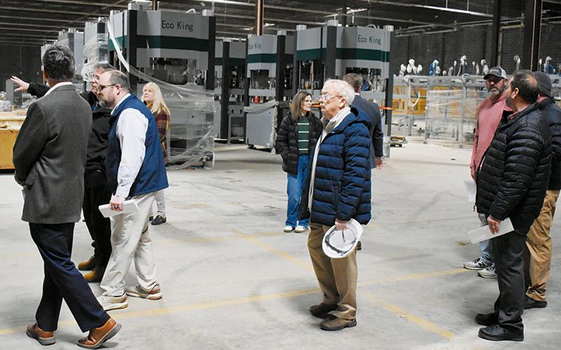 Local and regional officials explore the progress made inside EcoKing Solutions' renovated facility off Snowbird Road on Feb. 12. Photos by Kevin Hensley/editor@grahamstar.com
