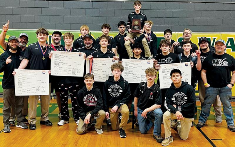 The Black Knights gather with the 1A/2A Western Regional Championship trophy, moments after securing the title Saturday in Spencer. Photo courtesy of Robbinsville Wrestling