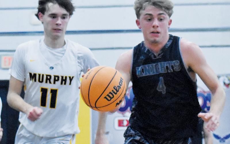 JV Black Knight Cameron Allison breaks away from a Murphy defender during Feb. 12's regular-season finale.
