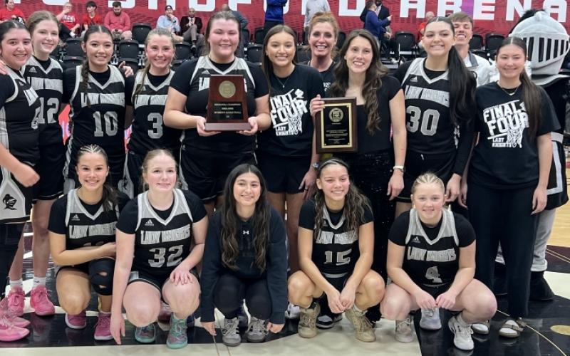 The Robbinsville Lady Knights display the North Carolina High School Athletic Association's 1A Western Regional Championship, moments after defeating Andrews 53-38 in the title game Thursday at Lenoir-Rhyne University. Photos by Kevin Hensley/sports@grahamstar.com