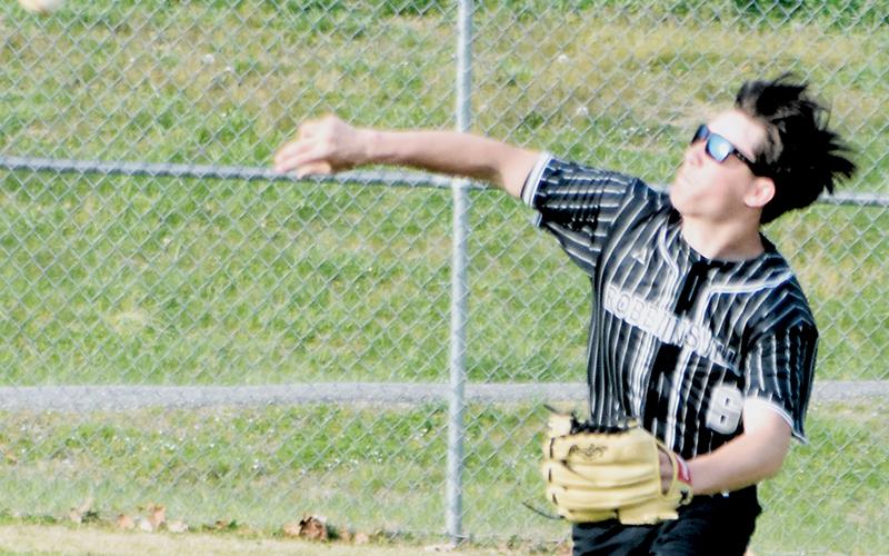 Jackson Lane fires a throw from right field during March 20's home game against Andrews. Photo by Kevin Hensley/sports@grahamstar.com